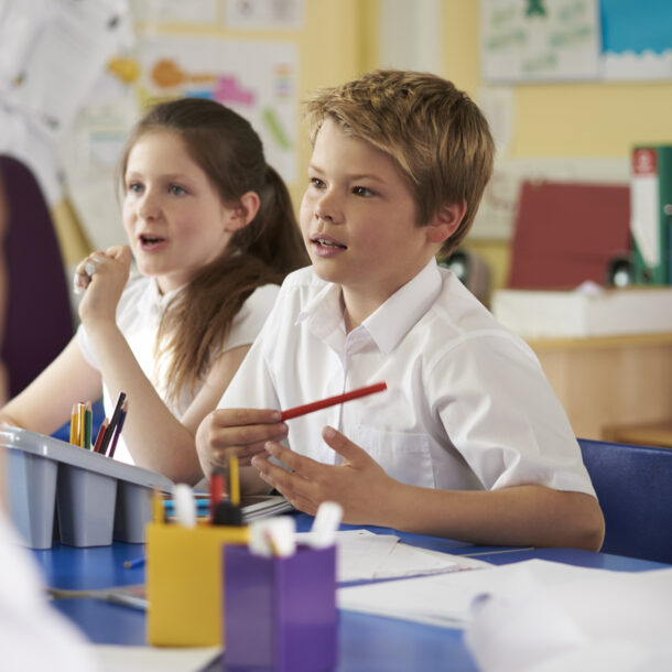 Pupils in class listening to the teacher